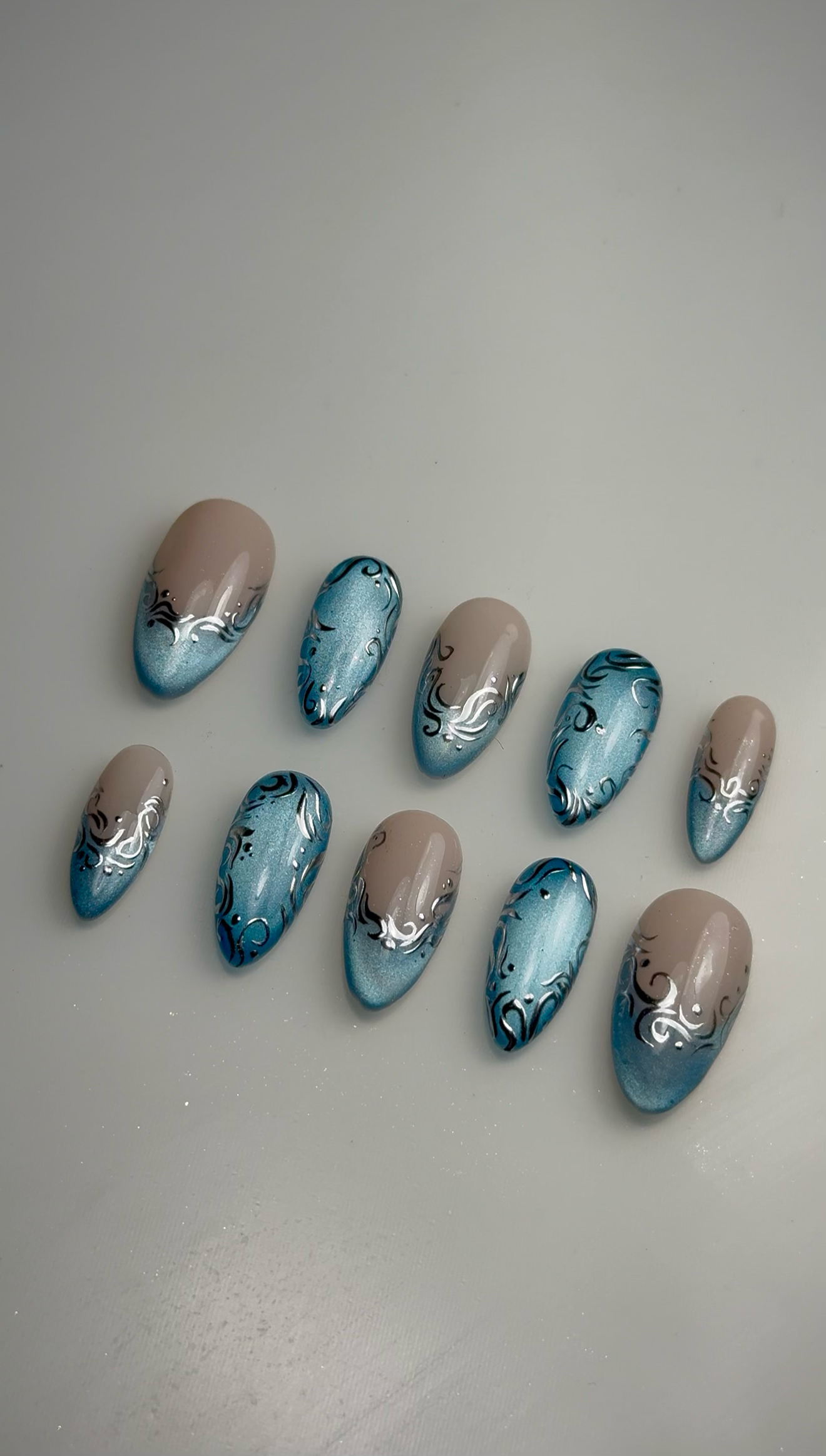 Blue Cat Eye + Silver Chrome Accent Nails